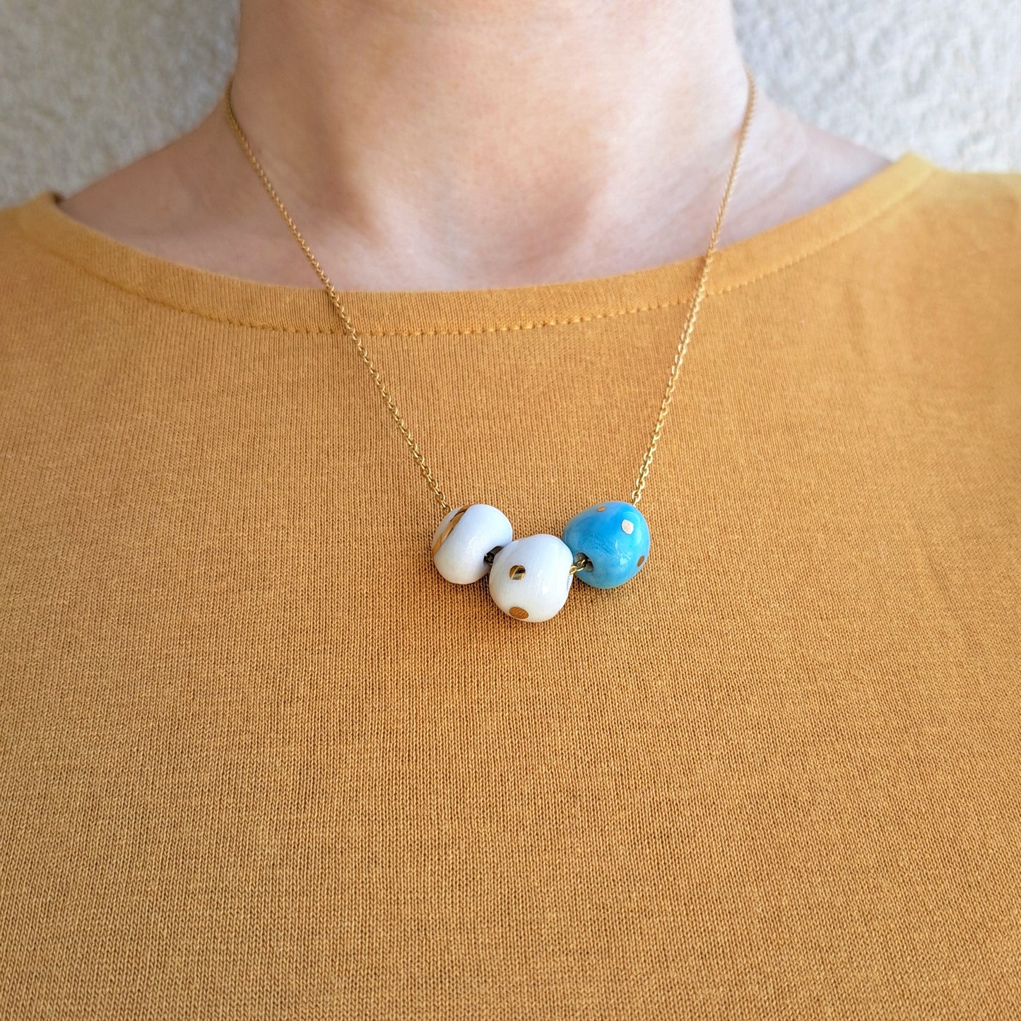 Porcelain necklace with gold "White, blue and gold"