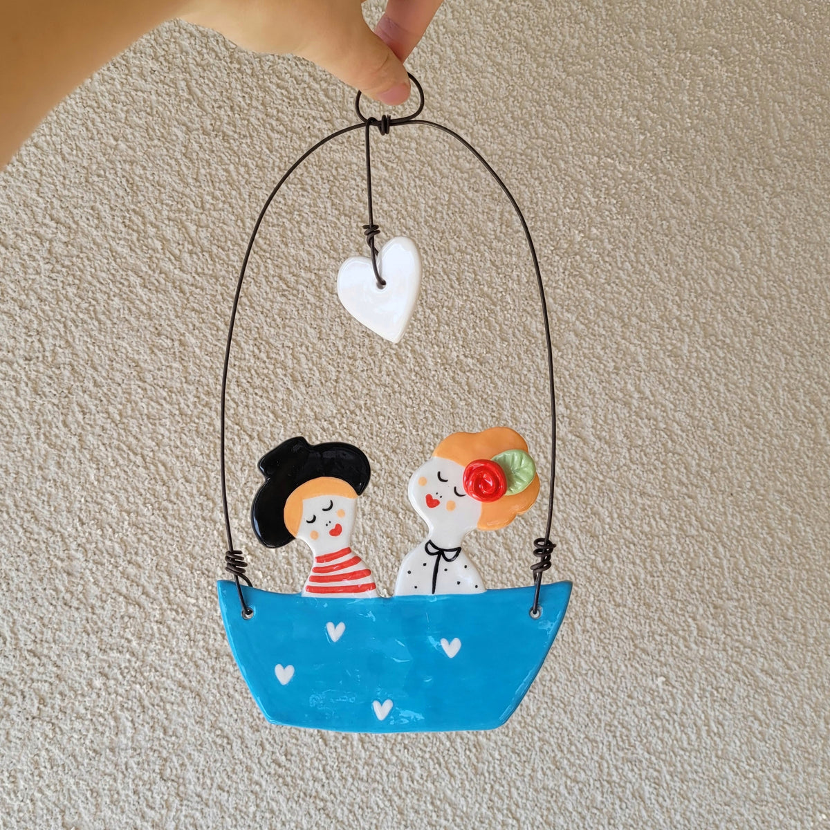 Ceramic wall hanging "Happy couple in a blue boat"