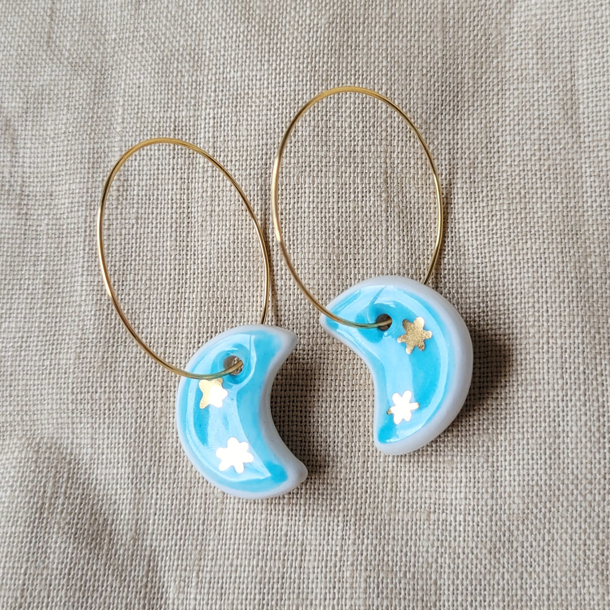 Porcelain dangle earrings with gold "Light blue moons with little gold stars"