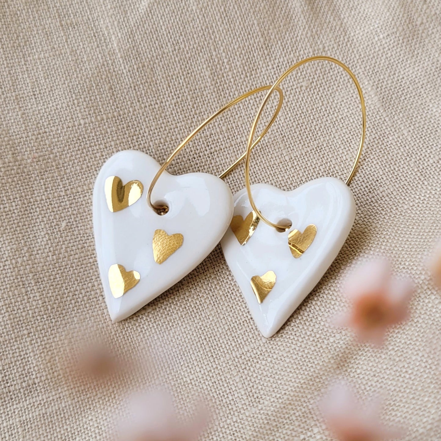 Porcelain dangle earrings with gold "Hearts with hearts"