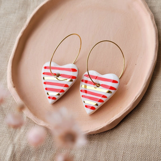 Porcelain dangle earrings with gold "Hearts with red stripes"