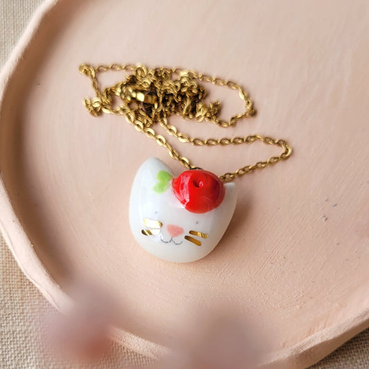 Porcelain necklace with gold "Kitty with red flower"