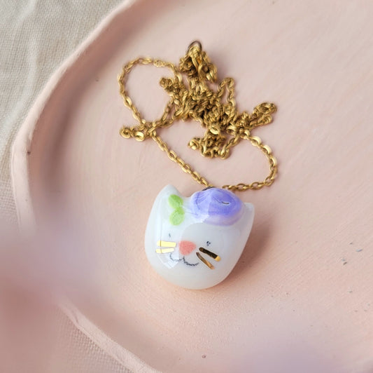 Porcelain necklace with gold "Kitty with purple flower"