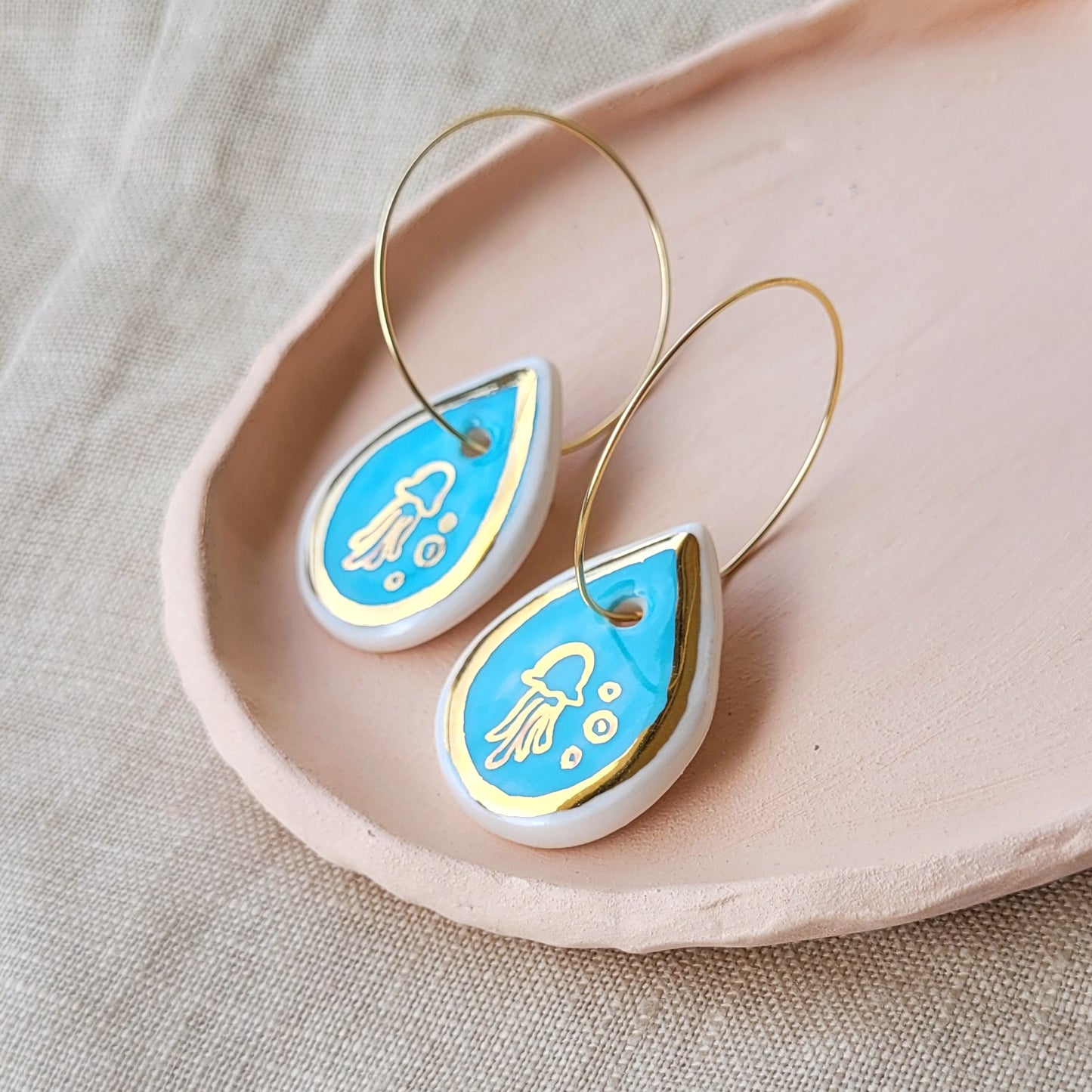 Porcelain dangle earrings with gold "Jellyfish in blue"