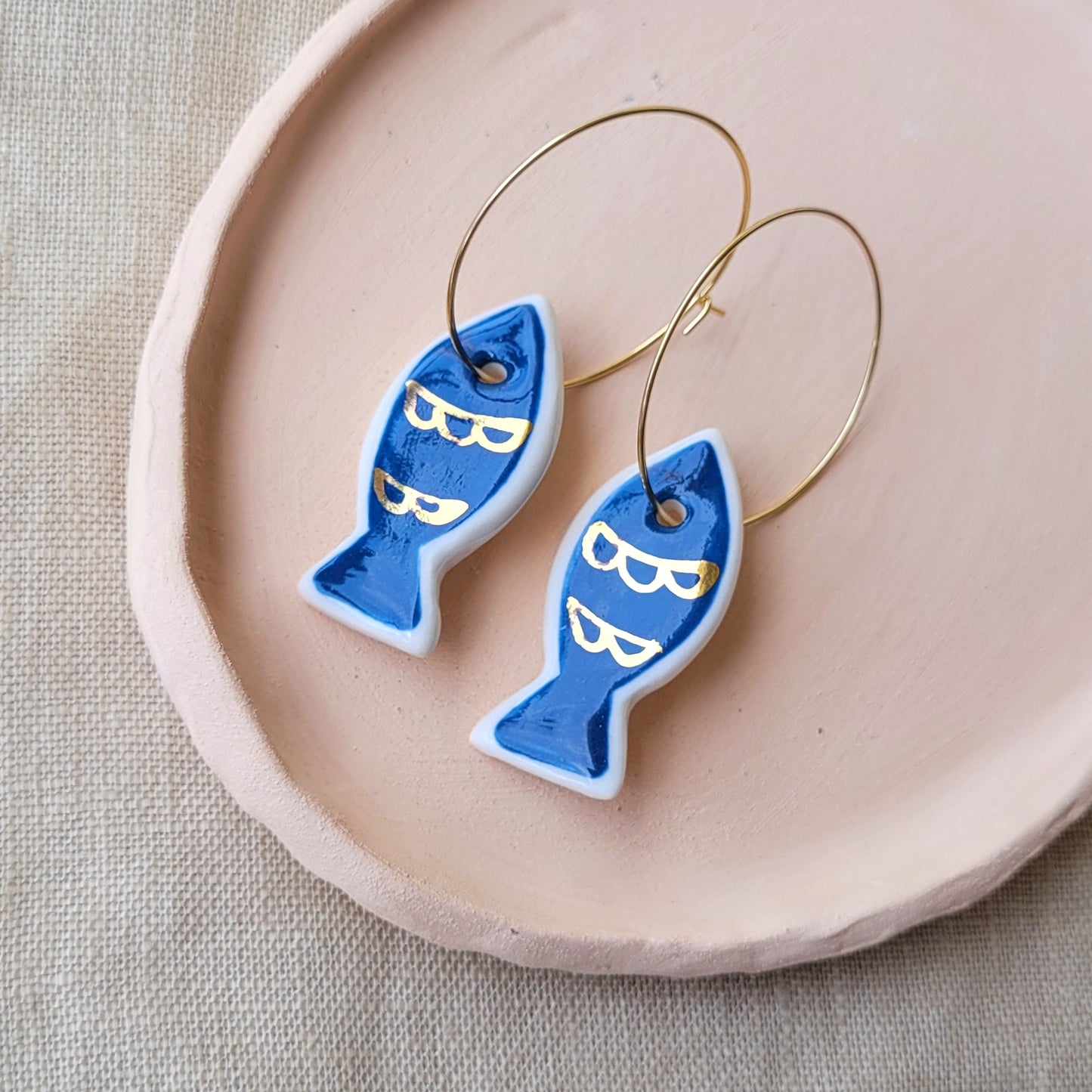 Porcelain dangle earrings with gold "Blue fish"