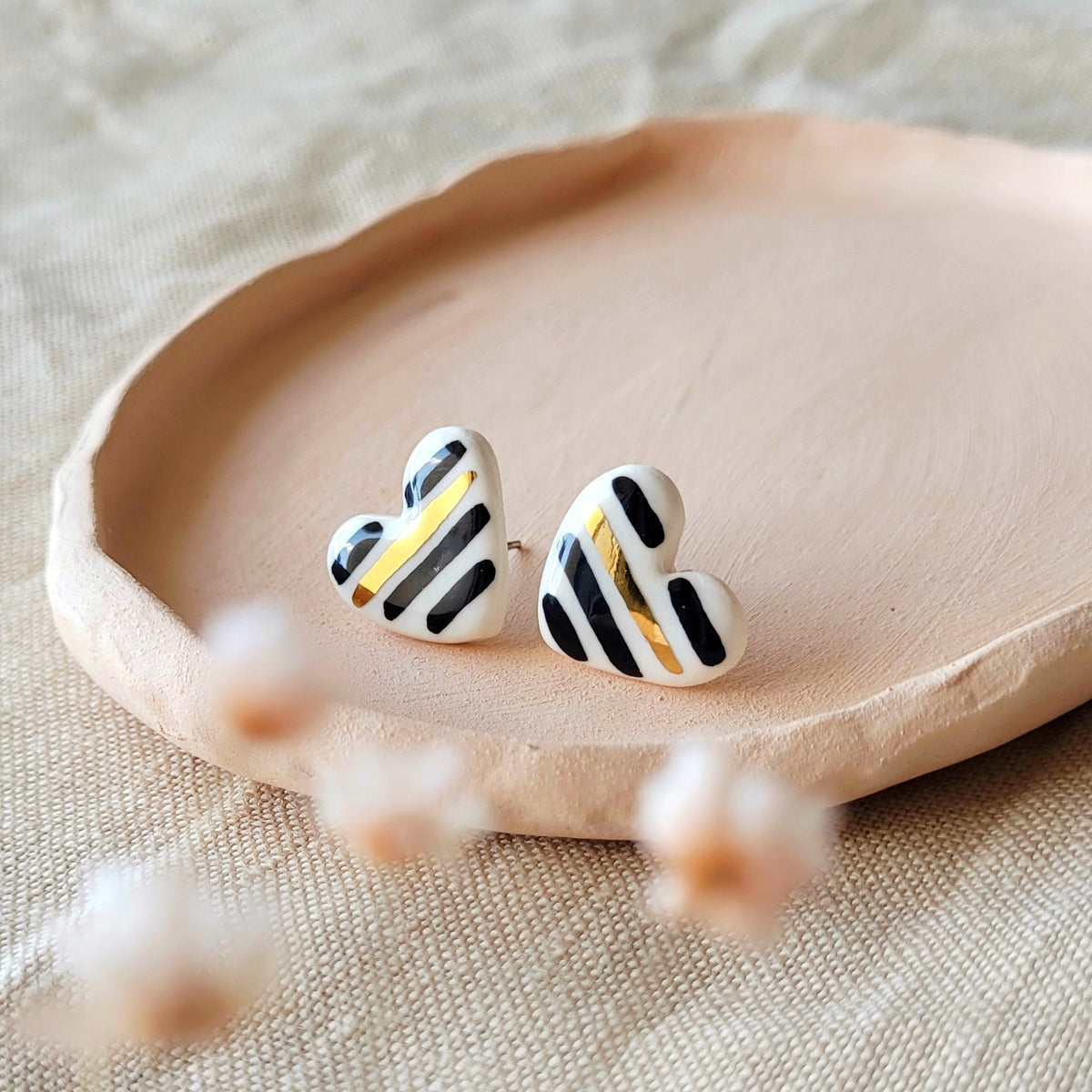 Porcelain stud earrings with gold "Hearts with black stripes"