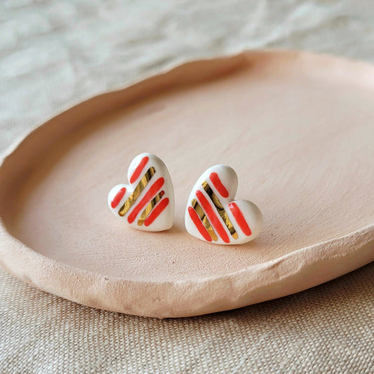 Porcelain stud earrings with gold "Hearts with red stripes"