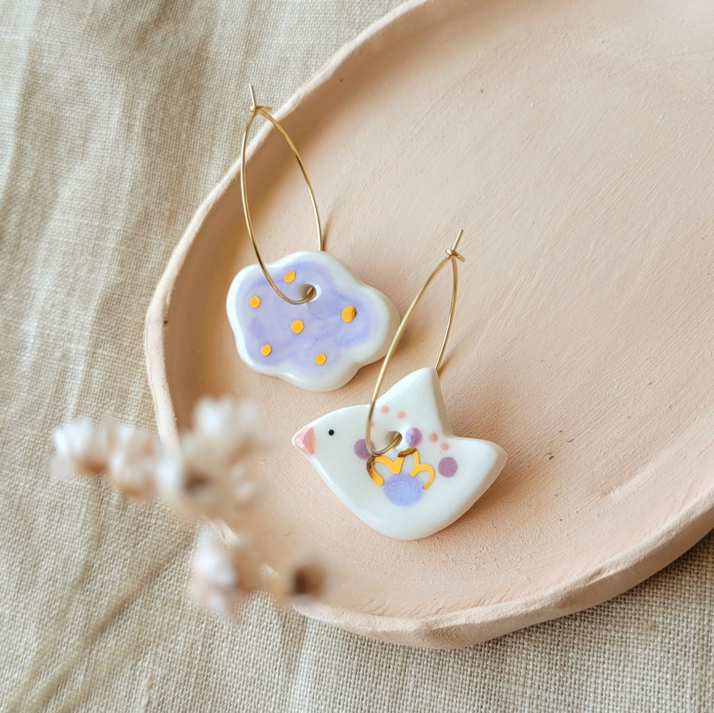 Porcelain dangle earrings with gold "White bird and light purple cloud"