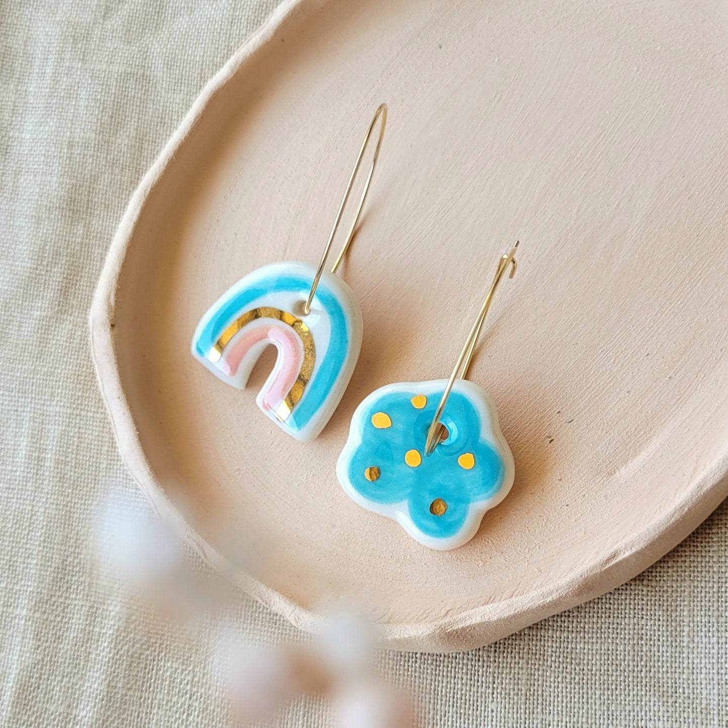 Porcelain dangle earrings with gold "Light blue cloud and rainbow with pink"