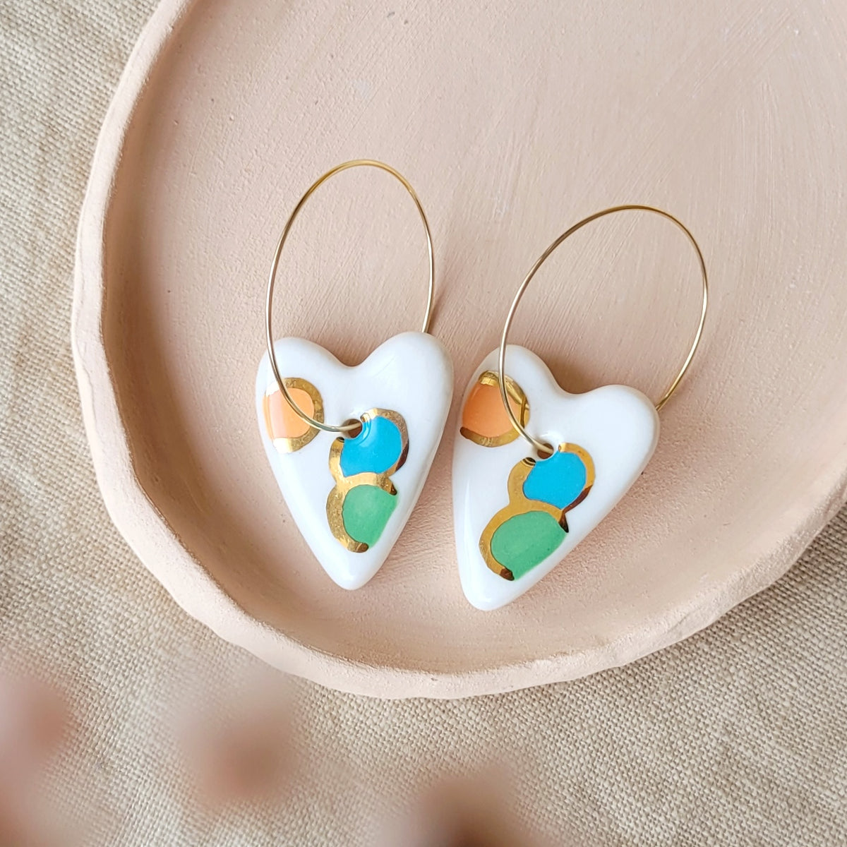 Porcelain dangle earrings with gold "Hearts in orange, blue and green"