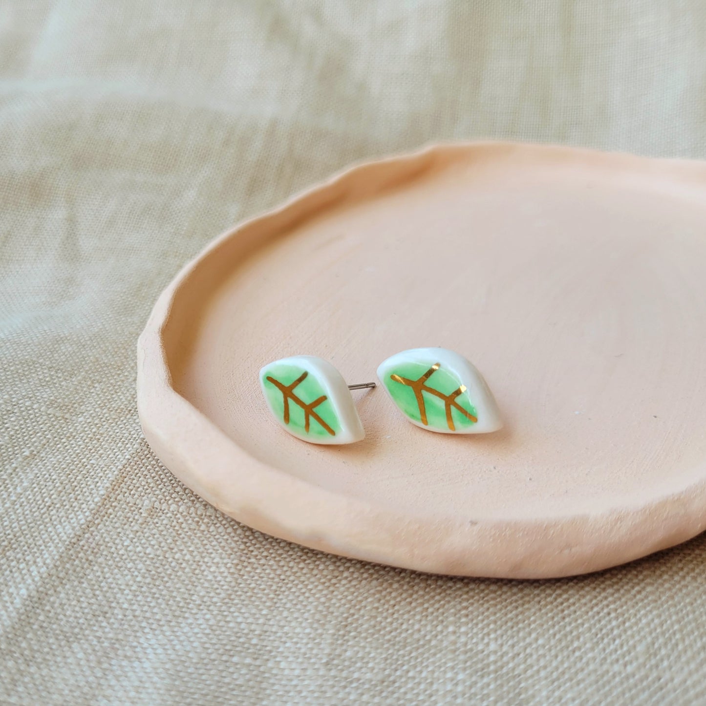 Porcelain stud earrings with gold "Tiny green leaves"