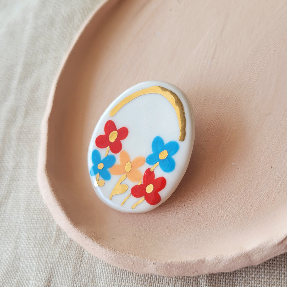 Porcelain brooch with gold "Flowers"