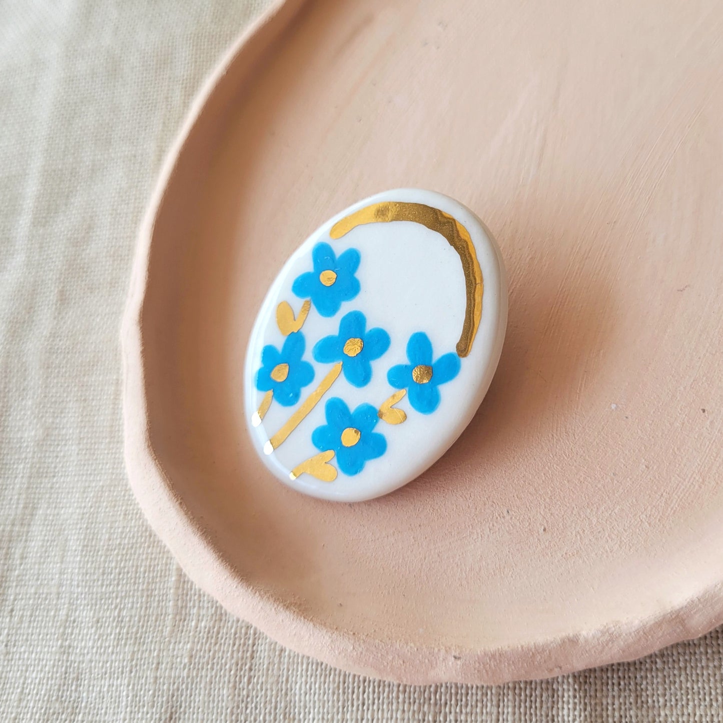 Porcelain brooch with gold "Blue flowers"