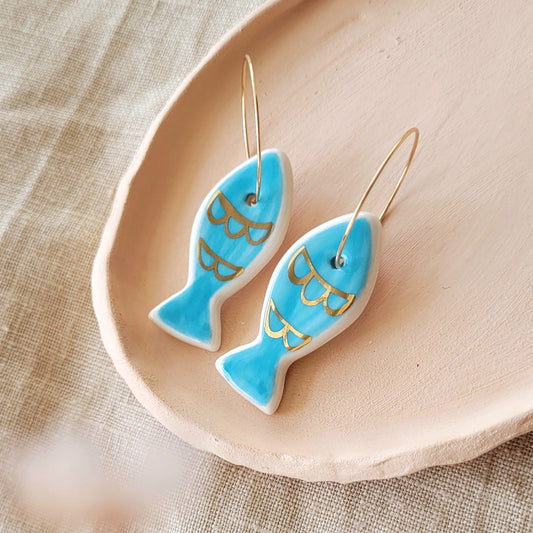 Porcelain dangle earrings with gold "Blue fish"