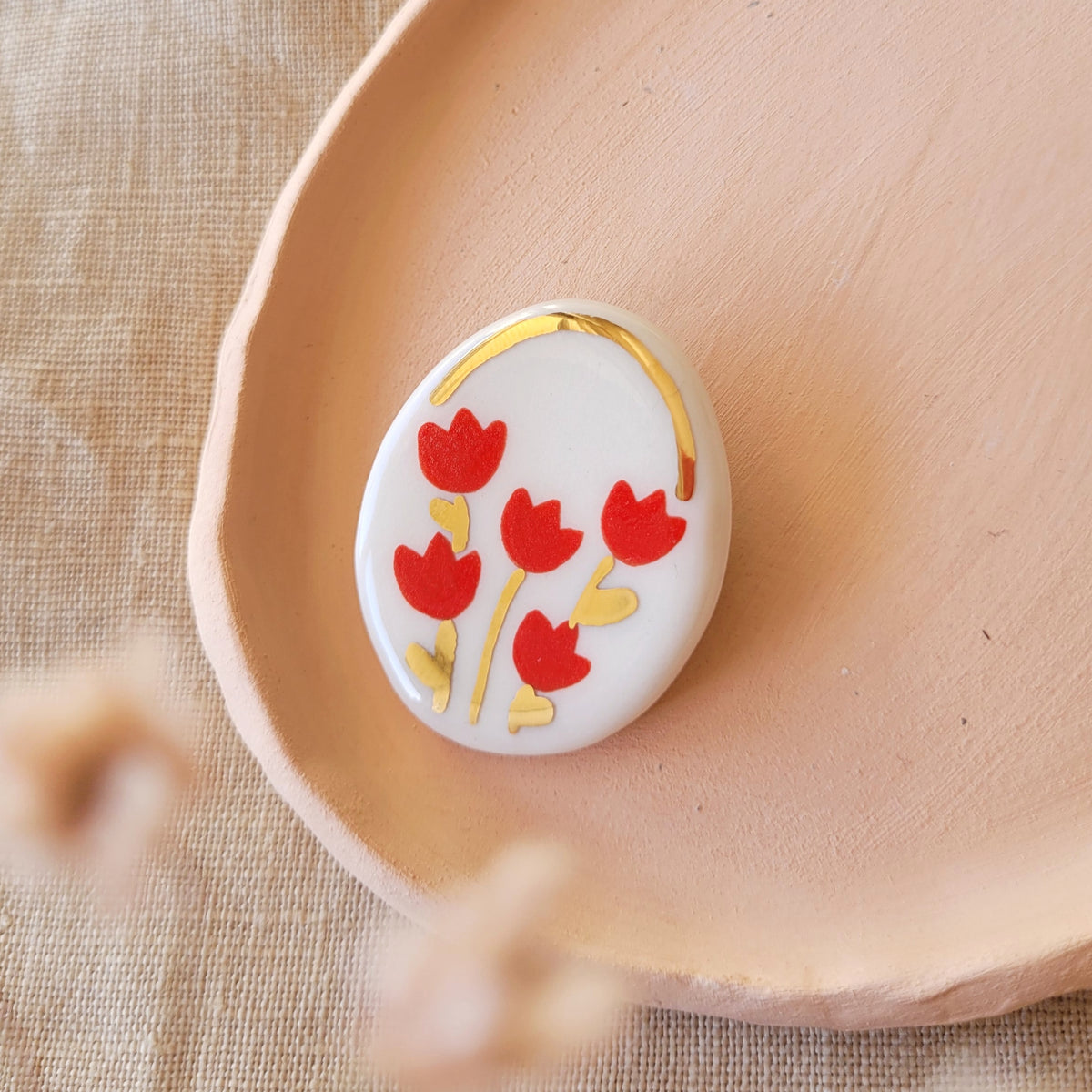 Porcelain brooch with gold "Red tulips"