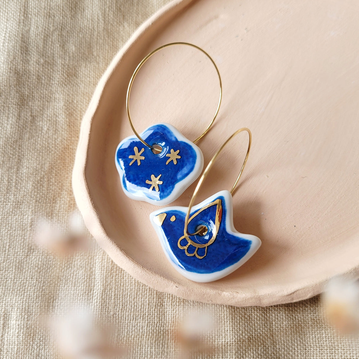 Porcelain dangle earrings with gold "Blue bird and cloud"