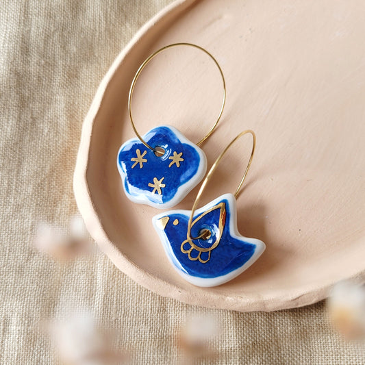 Porcelain dangle earrings with gold "Blue bird and cloud"
