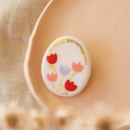 Porcelain brooch with gold "Pink, red and purple tulips"