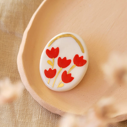 Porcelain brooch with gold "Red tulips"