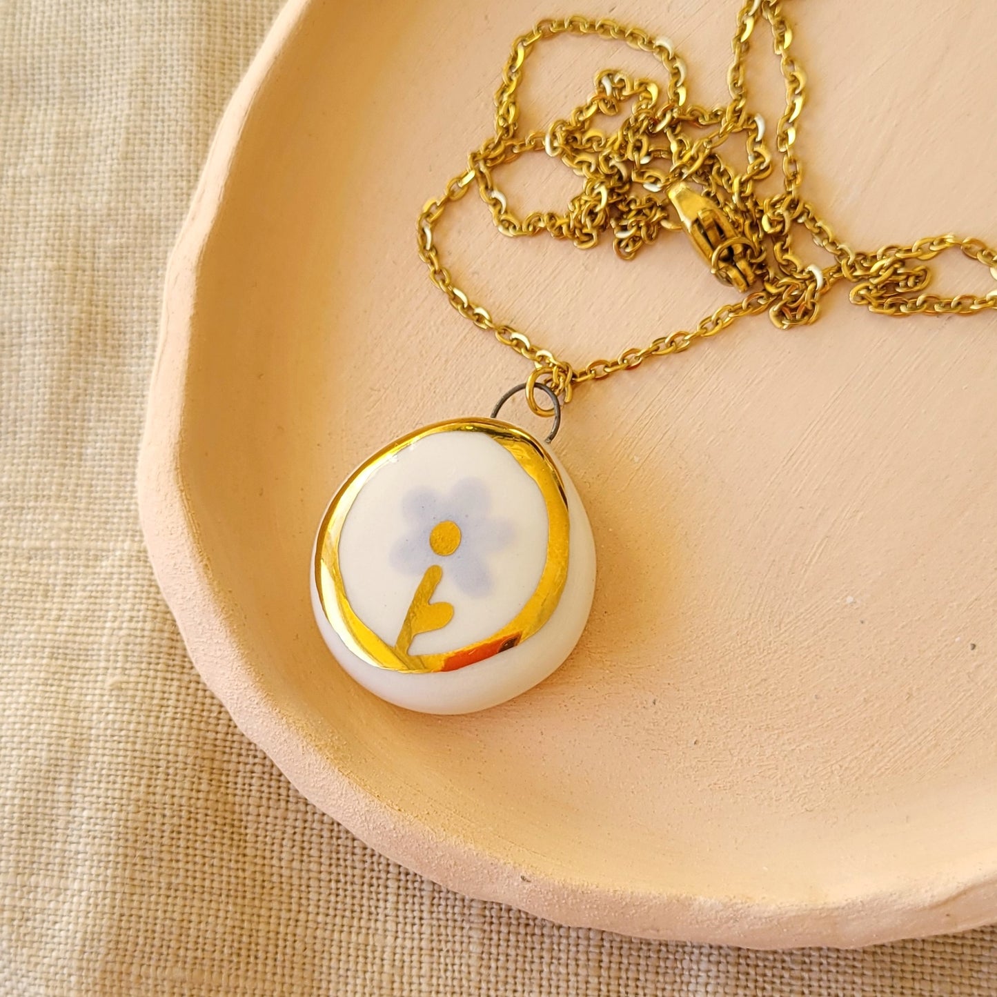 Porcelain necklace with gold "Light purple flower"