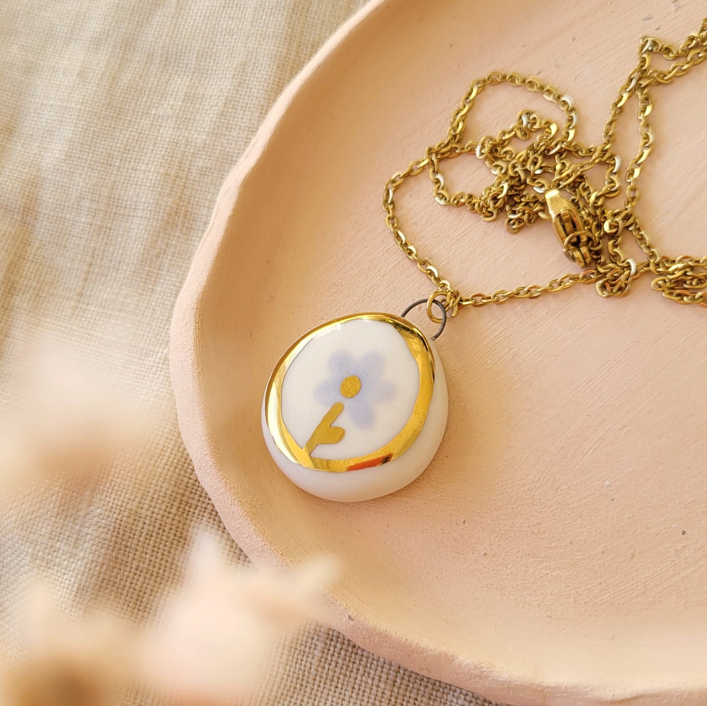 Porcelain necklace with gold "Light purple flower"