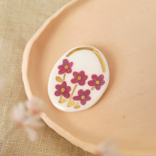 Porcelain brooch with gold "Flowers in dark pink"