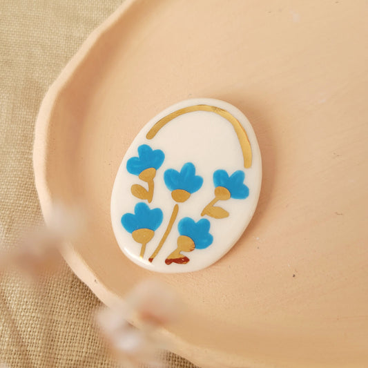 Porcelain brooch with gold "Blue flowers"