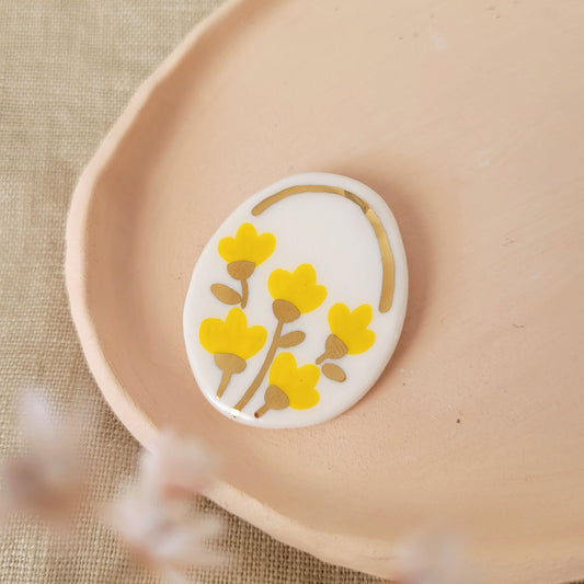 Porcelain brooch with gold "Yellow flowers"