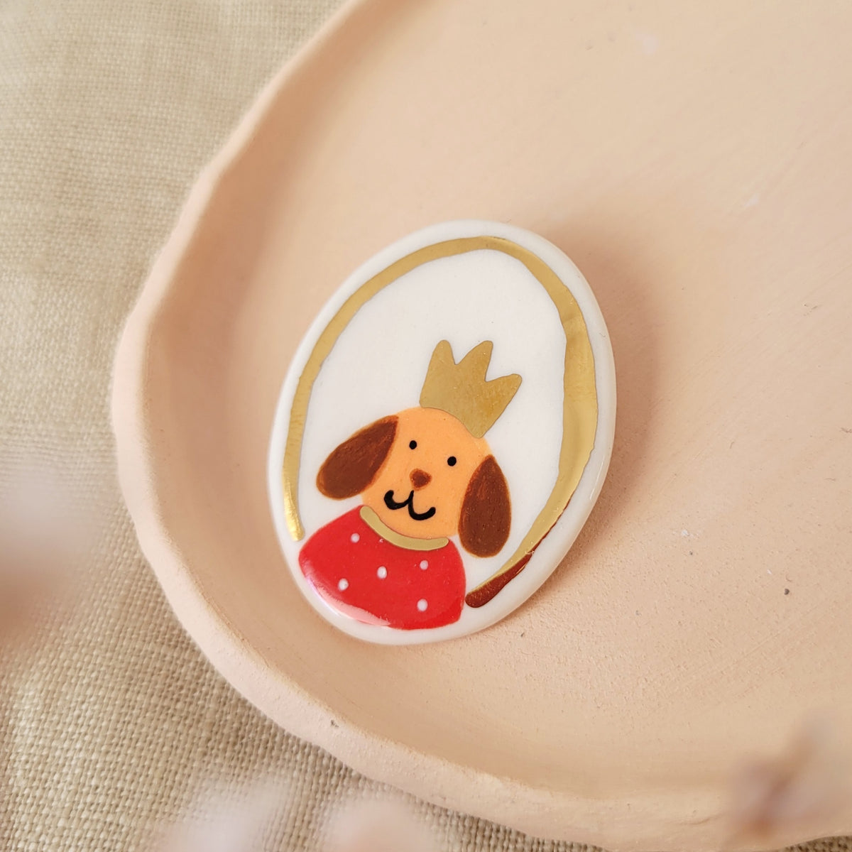 Porcelain brooch with gold "Peter"