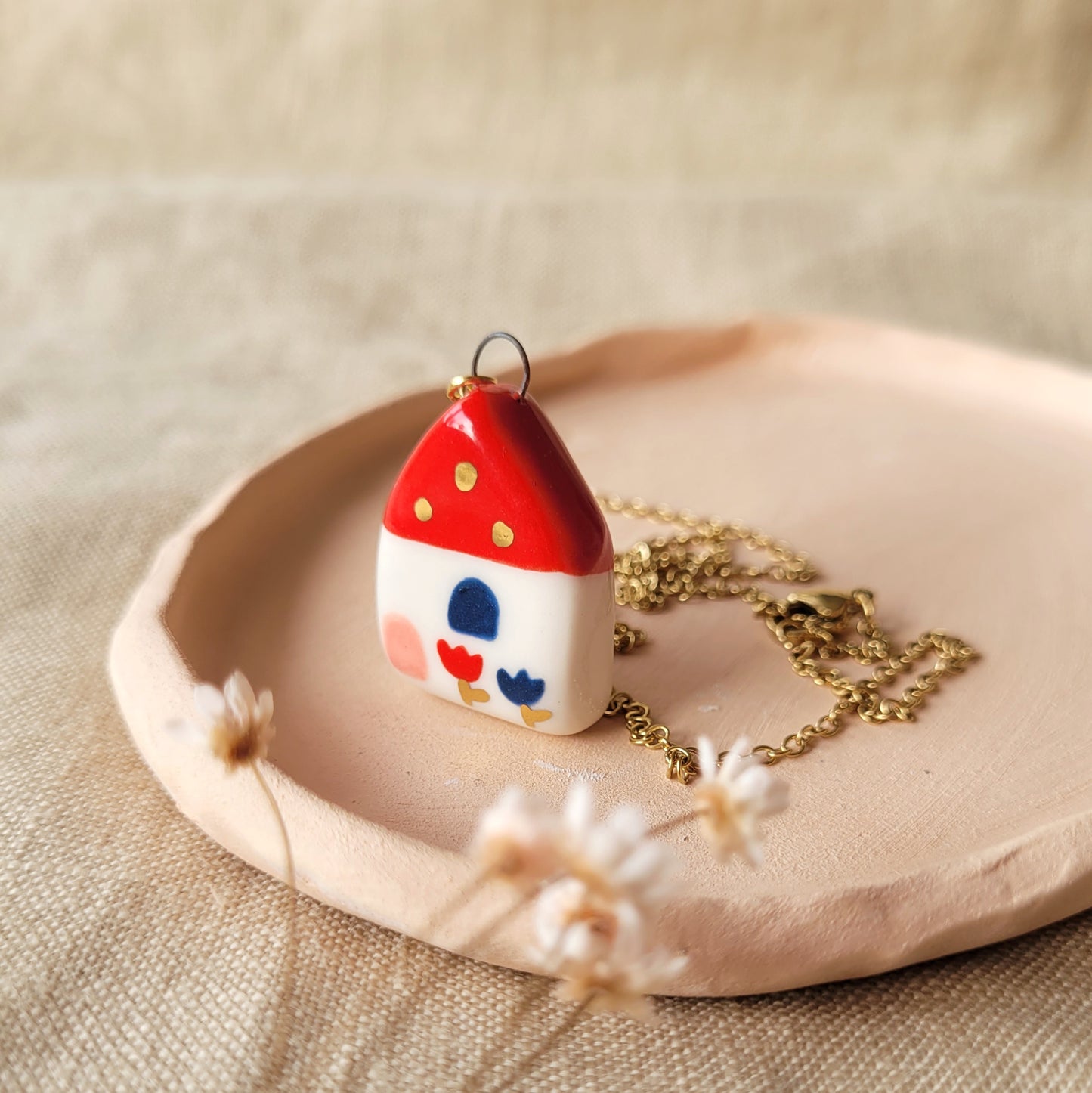 Porcelain necklace with gold "Red house with blue window"