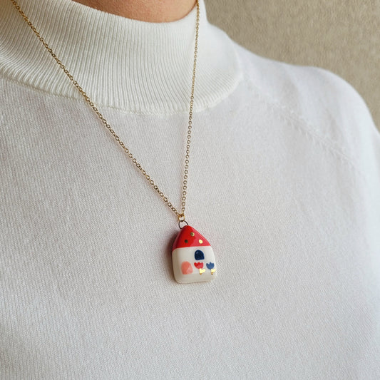 Porcelain necklace with gold "Red house with blue window"