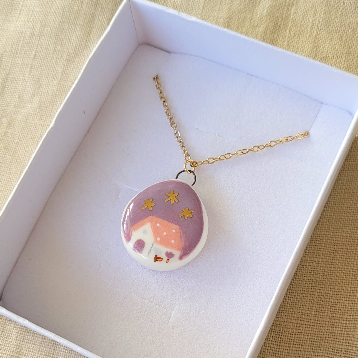 Porcelain necklace with gold "Pink house"