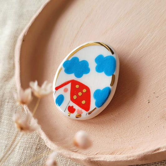 Porcelain brooch with gold "Cloudy day"