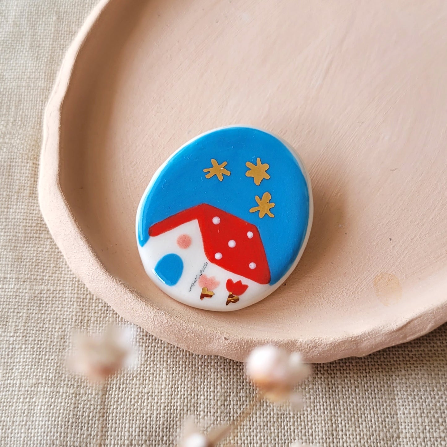 Porcelain brooch with gold "Red house in blue"