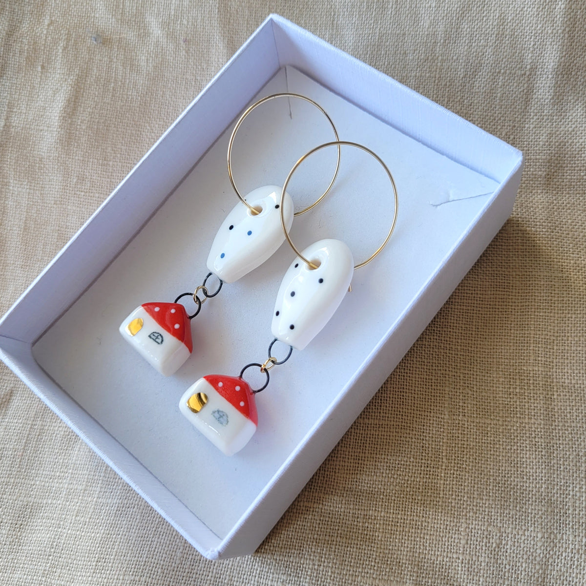 Porcelain dangle earrings with gold "Houses with balloons"