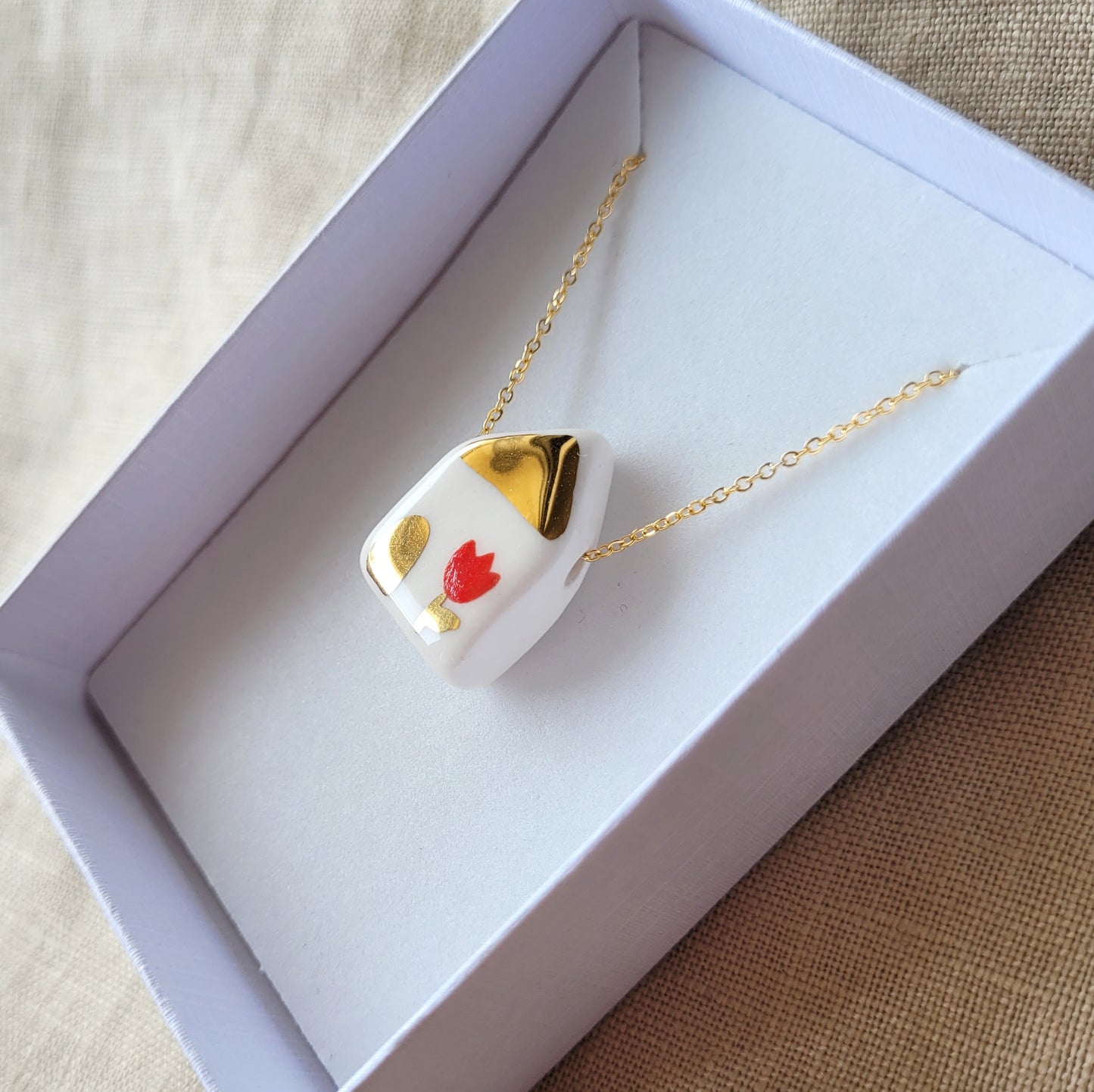 Porcelain necklace with gold "House with red tulip"