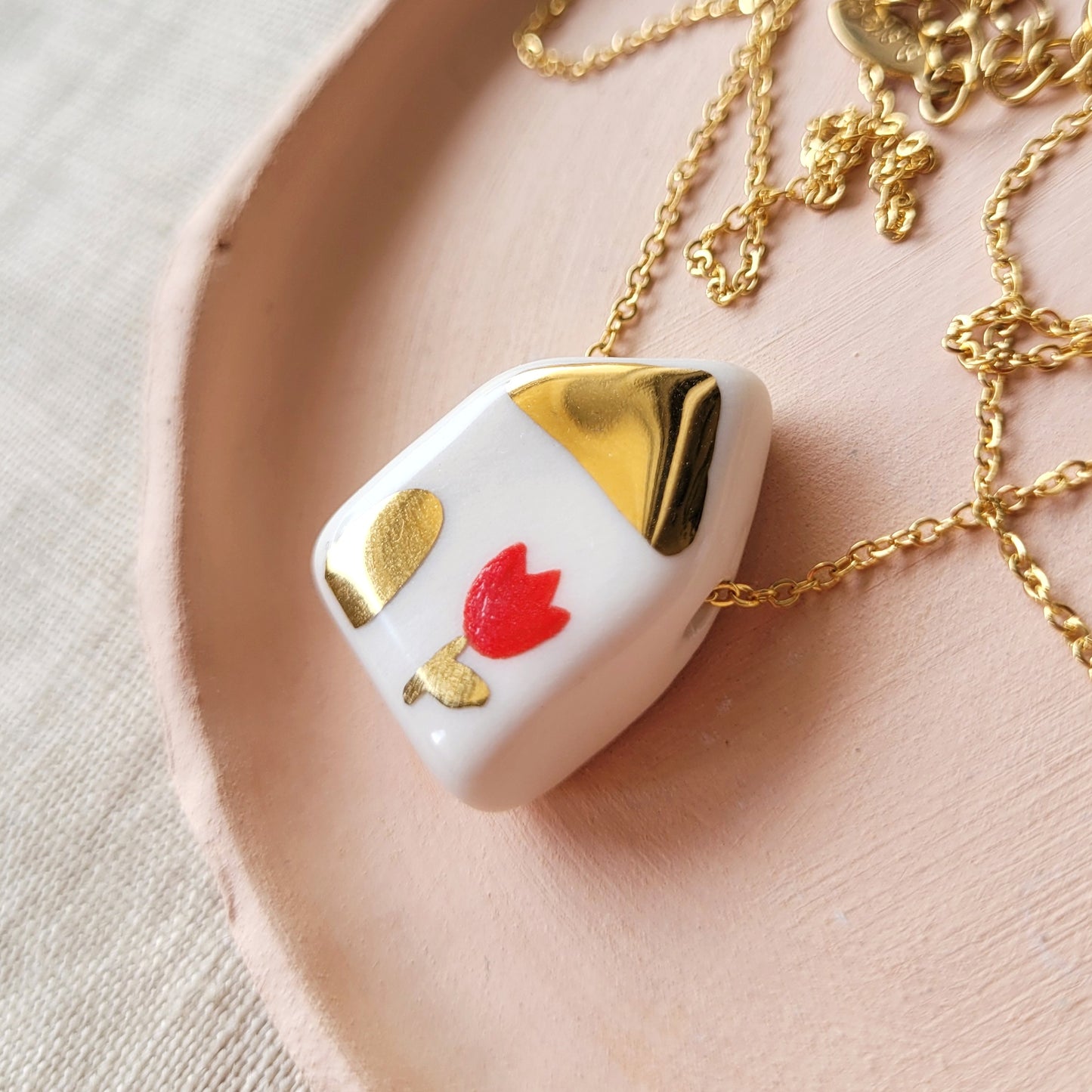 Porcelain necklace with gold "House with red tulip"