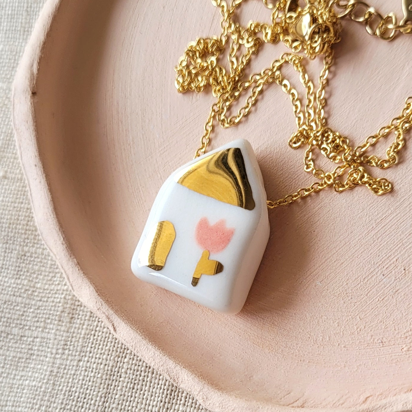 Porcelain necklace with gold "House with pink tulip"