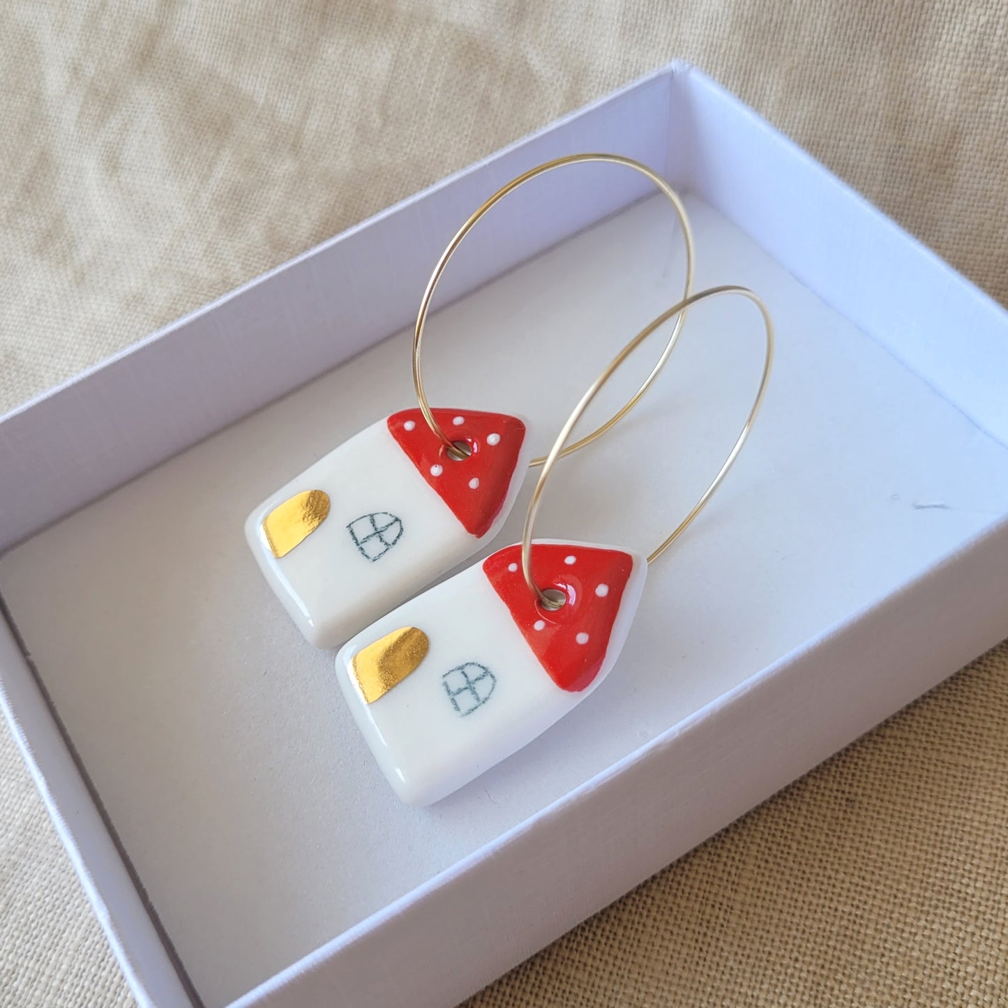 Porcelain dangle earrings with gold "Houses with golden doors"