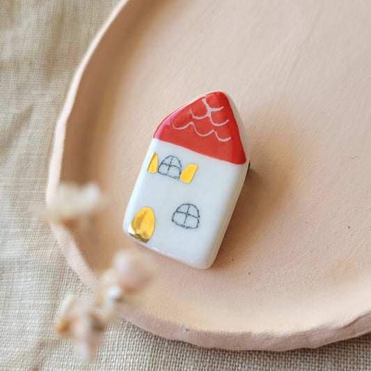 Porcelain brooch with gold "Little house"