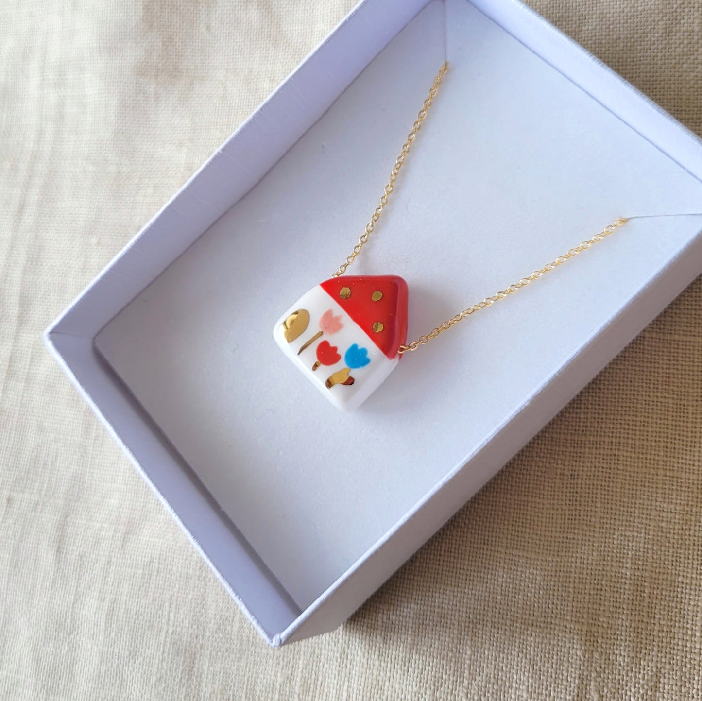 Porcelain necklace with gold "Red house with tulips"