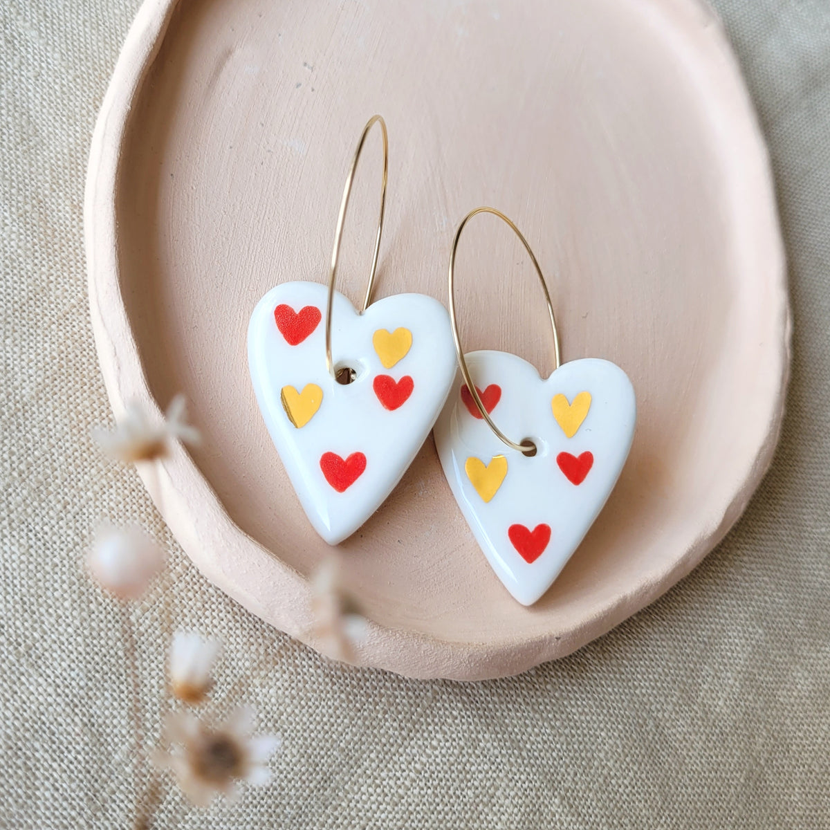 Porcelain dangle earrings with gold "Hearts with hearts"