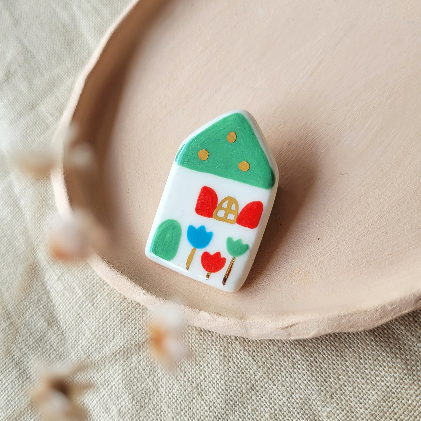 Porcelain brooch with gold "House with green roof"