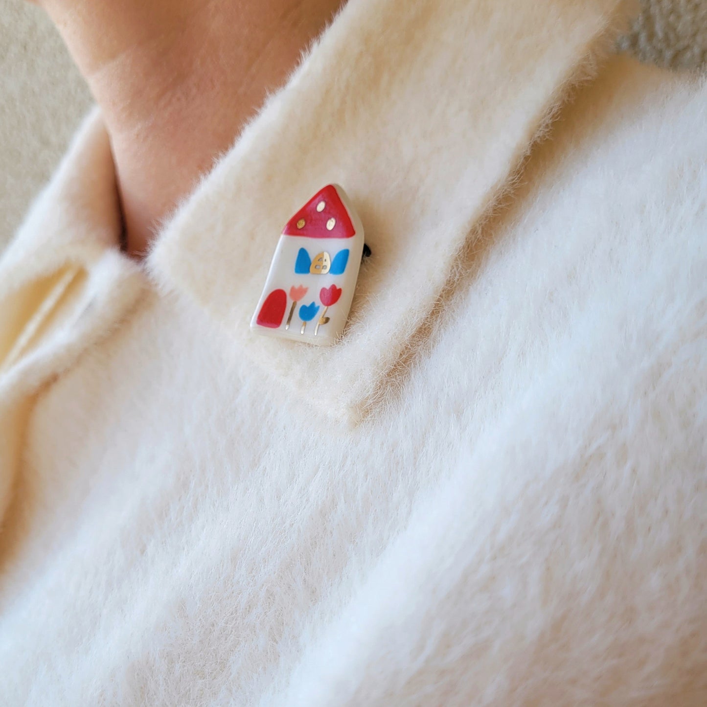 Porcelain brooch with gold "House with red roof"