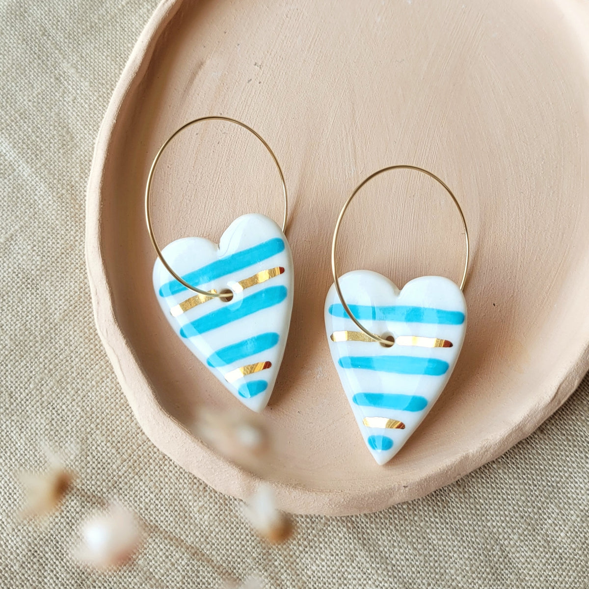 Porcelain dangle earrings with gold "Hearts with blue stripes"