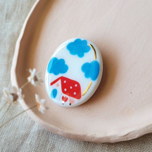 Porcelain brooch with gold "Red house"