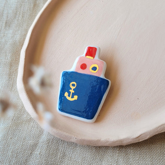 Porcelain brooch with gold "Dark blue boat"