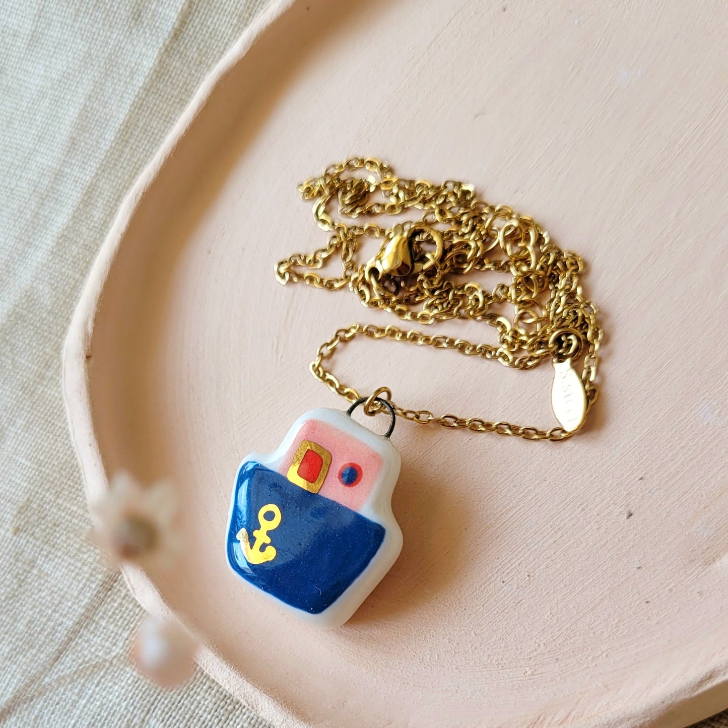 Porcelain necklace with gold "Dark blue boat"