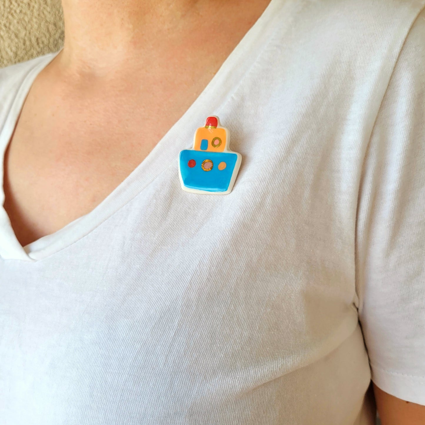Porcelain brooch with gold "Blue boat"