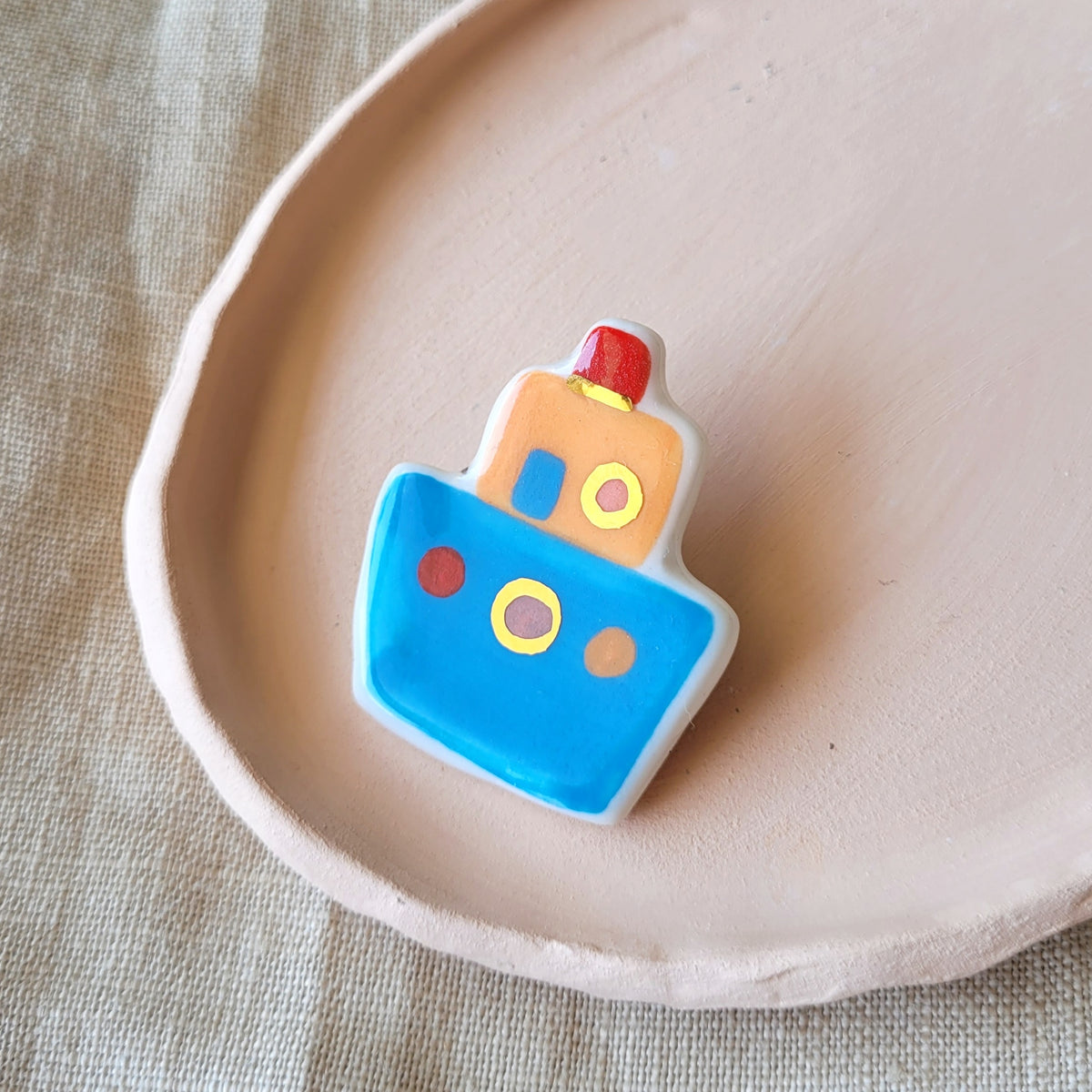 Porcelain brooch with gold "Blue boat"